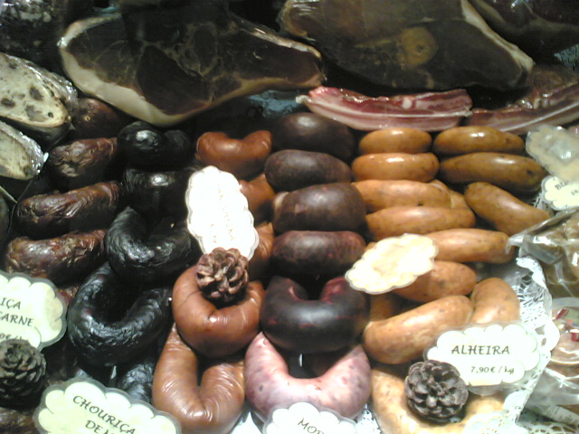 Portuguese sausages: chouriças, farinheiras, morcelas and alheiras, below. Presunto (cured ham), on top.
