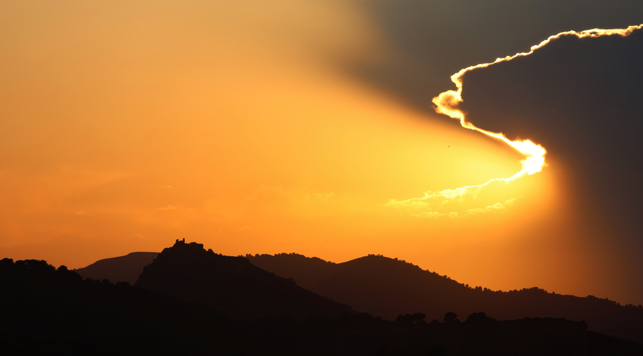 Castillo De Almenara and surrounding peaks during sunset, Almenara, Spain