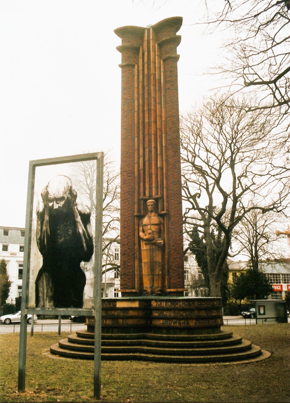 In the yard of the former garrison church to Altona, St. John's Church, on 5 October 1925, donated by the former 31er all 31ern memorial in the form of a 8.50 m high triangular monument of brick and ceramics at the sides watching in relief each man with sword and shield, was inaugurated. Each one of the men symbolizes the active, reserve and Landwehr Regiment of the 31.Designed by the architects Heinrich Esselmann and Max Gerntke in cooperation with the sculptor August Henneberger the memorial was executed by John Kriegeris.The inscription on the monument reads translated:The fallen heroes to the grateful memory, the survivors as a warning, the coming generations to emulate.It follows - as countless war memorials of the 19th and 20th century - the inscription (dedication) on the Prussian National Monument for the Liberation Wars on Kreuzberg hill in Berlin. It is also a quote from the speech of Paul von Hindenburg at the groundbreaking ceremony of the Tannenberg Memorial.The parish of St. John worked in connection with a student project of the University of Hamburg, Design Department, is a redesign of the monument. Boards of the Altona artist Rainer Tiedje deny since the direct top view of the martial warrior figures. Destroyed a 2009 panel of the project was replaced by the artist Wiebke Logemann.