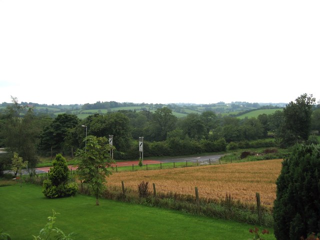 Farmland,  Annahilt Farmland on the outskirts of Annahilt, the derestriction signs are on the Ballynahinch Road in the foreground.