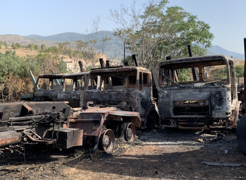 Burnt trucks in Ano liosia 2021 wildfires