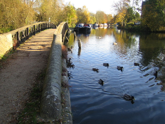 Grand Union Canal in Rickmansworth The bridge on the left carries the towpath over the River Colne which diverges from the Grand Union Canal at this point.