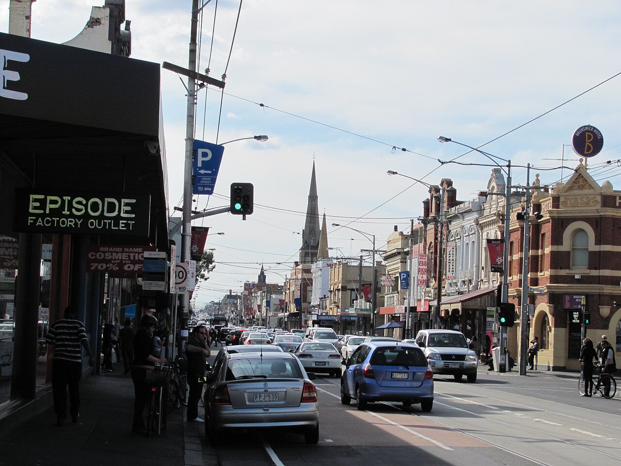 Sydney Road (an early stage of the Hume Highway) as a "main street" in the suburb of Brunswick, Victoria, Australia.