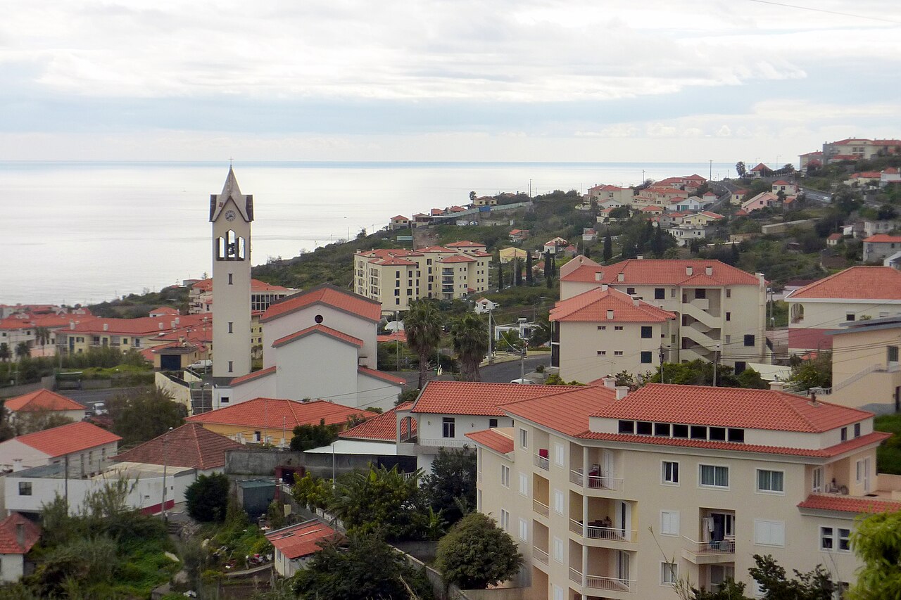 View of houses and the church Igreja Paroquial da Assomada in Caniço, Madeira