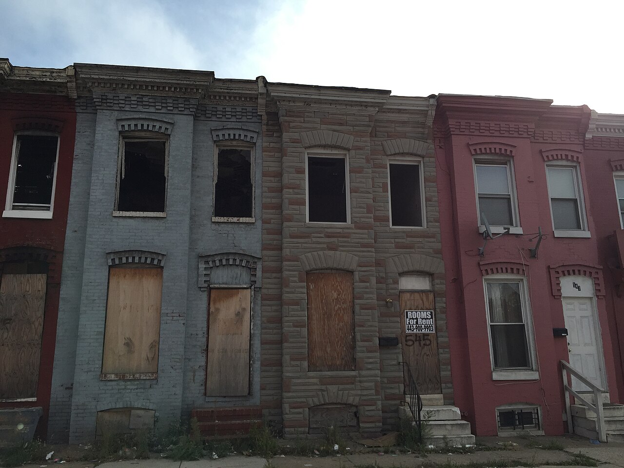 Abandoned row homes along Monroe Street between U.S. Route 1 (Wilkens Avenue) and Eagle Street in Baltimore City, Maryland