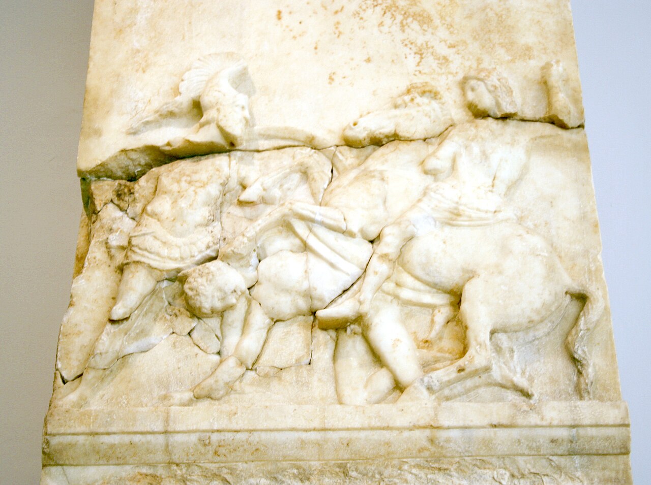 A funerary stele for a Panchares (possibly fell in the battle of Chaeronea, 338 b.C.), showing a relief of a footman killed by a Macedonian horseman, topping a loutrophoros vase (meaning that the man died unmarried). On display in the Room of the so-called "Monuments for the Metics", at the first floor of the Archaeological Museum of Piraeus (Athens). 338 BC? Picture by Giovanni Dall'Orto, November 14 2009.
