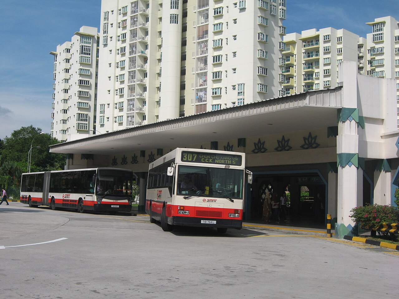 Choa Chu Kang Bus Interchange, Singapore. SMRT Buses. From right to left: Hispano bodied Mercedes-Benz O 405 (CAC, TIB764L, built 1995) and Hispano Habit on Mercedes-Benz O405G Euro 2 (probably TIB1028Y, built 2000).