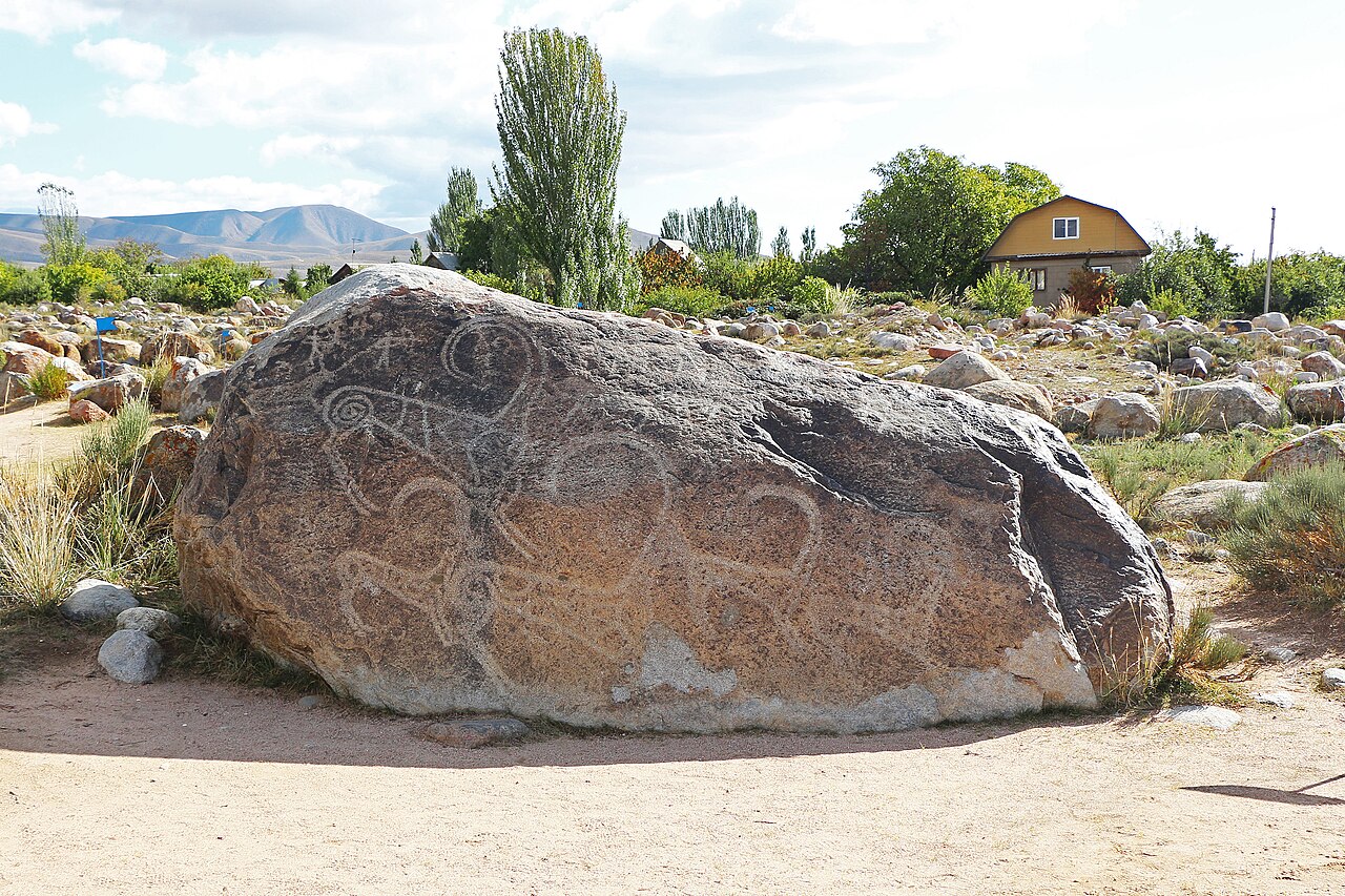 Petroglyph Museum of Cholpon-Ata, Kyrgyzstan. The petroglyph depicts an ibex hunt with a snow leopard.