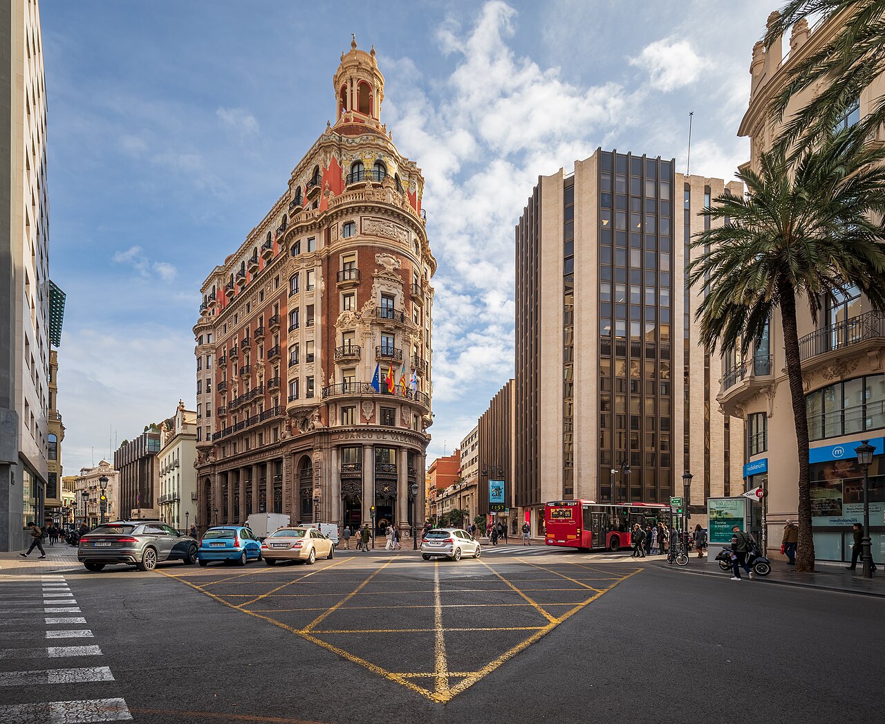 The intersection between the streets Carrer de les Barques, Carrer del Poeta Querol, Carrer del Pintor Sorolla, Carrer de Don Juan de Austria and Carrer de Pascual i Genis in Ciutat Vella, Valencia, Spain in 2024 January. The intersection is located at Banco de Valencia building.