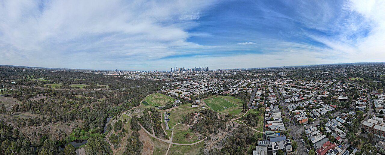 Aerial vista of Quarries Park facing the city skyline