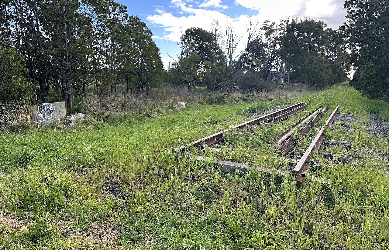 Future site of East Cranbourne railway station (with abandoned tracks from the South Gippsland railway line visible) in August 2026