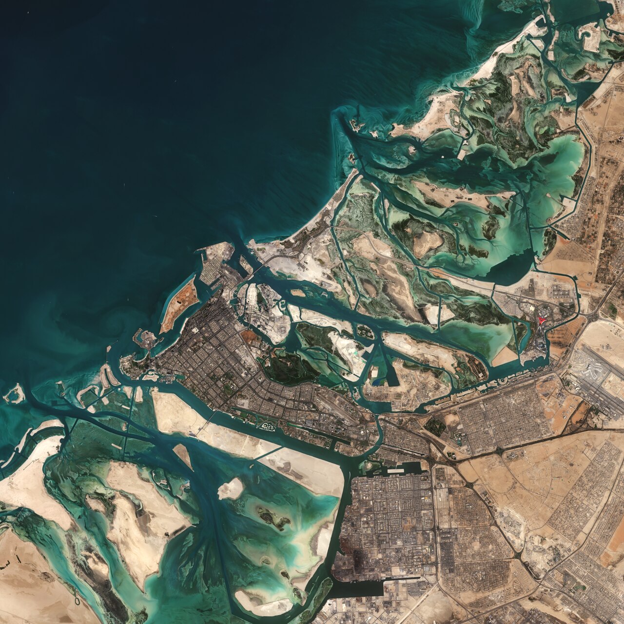 The Copernicus Sentinel-2 mission takes us over part of Abu Dhabi – one of the seven emirates that constitute the United Arab Emirates (UAE).Covering an area of approximately 67 000 sq km, the Emirate of Abu Dhabi is the largest emirate in the UAE – accounting for around 87% of the total land area of the federation. Abu Dhabi has around 200 islands lying along its 700 km long coastline.The city of Abu Dhabi, after which the emirate is named, is located on an island in the Persian Gulf and can be seen slightly below the centre of the image. Abu Dhabi is the capital and the second-most populous city of the UAE – after Dubai. The city is directly connected to the mainland by three bridges: Maqta, Mussafah and Sheikh Zayed.Just east of the city lies the Mangrove National Park, visible as a dark green patch of land. The protected area is around 20 sq km and includes mangrove forests, salt marshes, mudflats and is home to more than 60 bird species.The waters surrounding Abu Dhabi are said to hold the world’s largest population of Indo-Pacific humpback dolphins. The lighter aqua colours are shallow waters, which contrast with the dark coloured waters of the Gulf.The iconic red roof of Ferrari World can be seen in the centre-right of the image. The Ferrari-themed park is located on Yas Island and is said to be the world’s largest indoor theme park. Abu Dhabi International Airport is visible southeast of the park.Sentinel-2 is a two-satellite mission to supply the coverage and data delivery needed for Europe’s Copernicus programme. The mission’s frequent revisits over the same area and high spatial resolution allow changes in water bodies to be closely monitored.This image, captured on 27 January 2019, is also featured on the Earth from Space video programme.