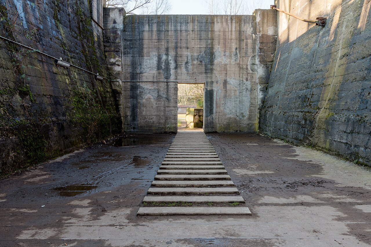 Ore bunkers in Landschaftspark Duisburg-Nord in Duisburg, North Rhine-Westphalia, GermanyThe Landschaftspark Duisburg-Nord (also known as “LaPaNo” or “LaPaDu” for short) is a landscape park covering around 180 hectares surrounding a disused steelworks in Duisburg-Meiderich. The former plant was founded in 1902 by August Thyssen as a “joint-stock company for metallurgical operations” to supply his Siemens-Martin steelworks in Bruckhausen and Styrum, and went into operation on May 16, 1903, with the firing up of blast furnace 1. In 1985, blast furnace 5 was shut down after just twelve years of operation due to overcapacity on the European steel market, making it the last remaining blast furnace. In the 1990s, the halls, buildings, and outdoor areas were redesigned according to plans by architects Peter Latz + Partner. In 1994, the park was opened to the public.