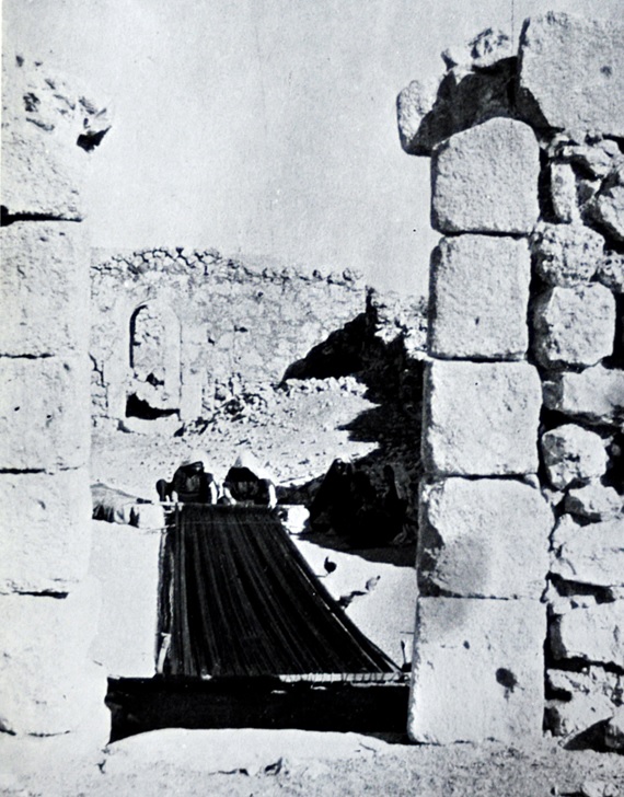 Dura, Palestine, 1930s. Women weaving carpet.