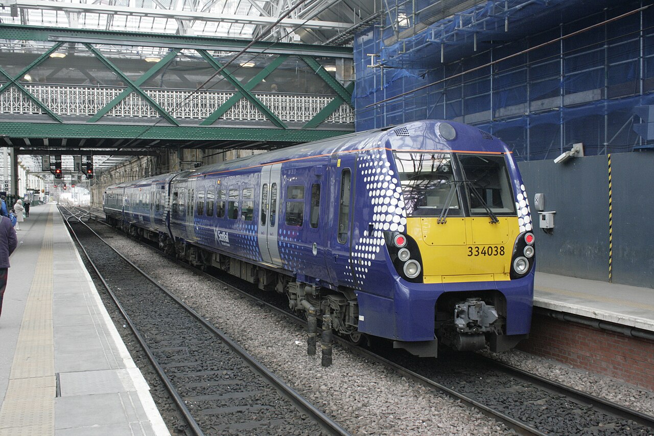 A ScotRail Saltire-liveried Class 334, no 334038, sits at Edinburgh Waverley having just completed a North Clyde Line run from Helensburgh Central.