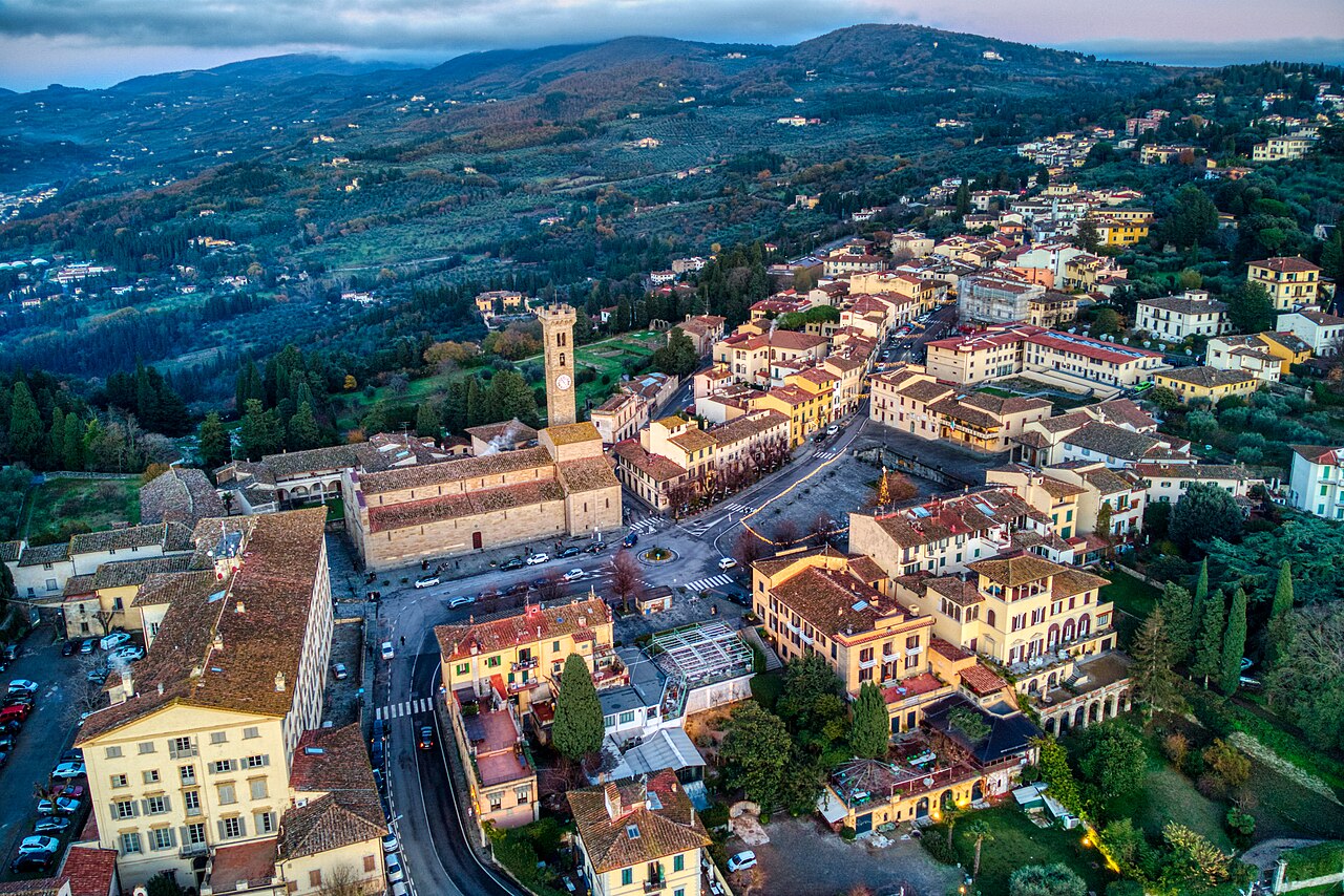 Aerial view of Fiesole, FI, Italy, including Piazza Mino, the cathedral, diocesan seminary, episcopal palace, Etruscan ruins, Praetorian palace (town hall), and Santa Maria Primerana Church.