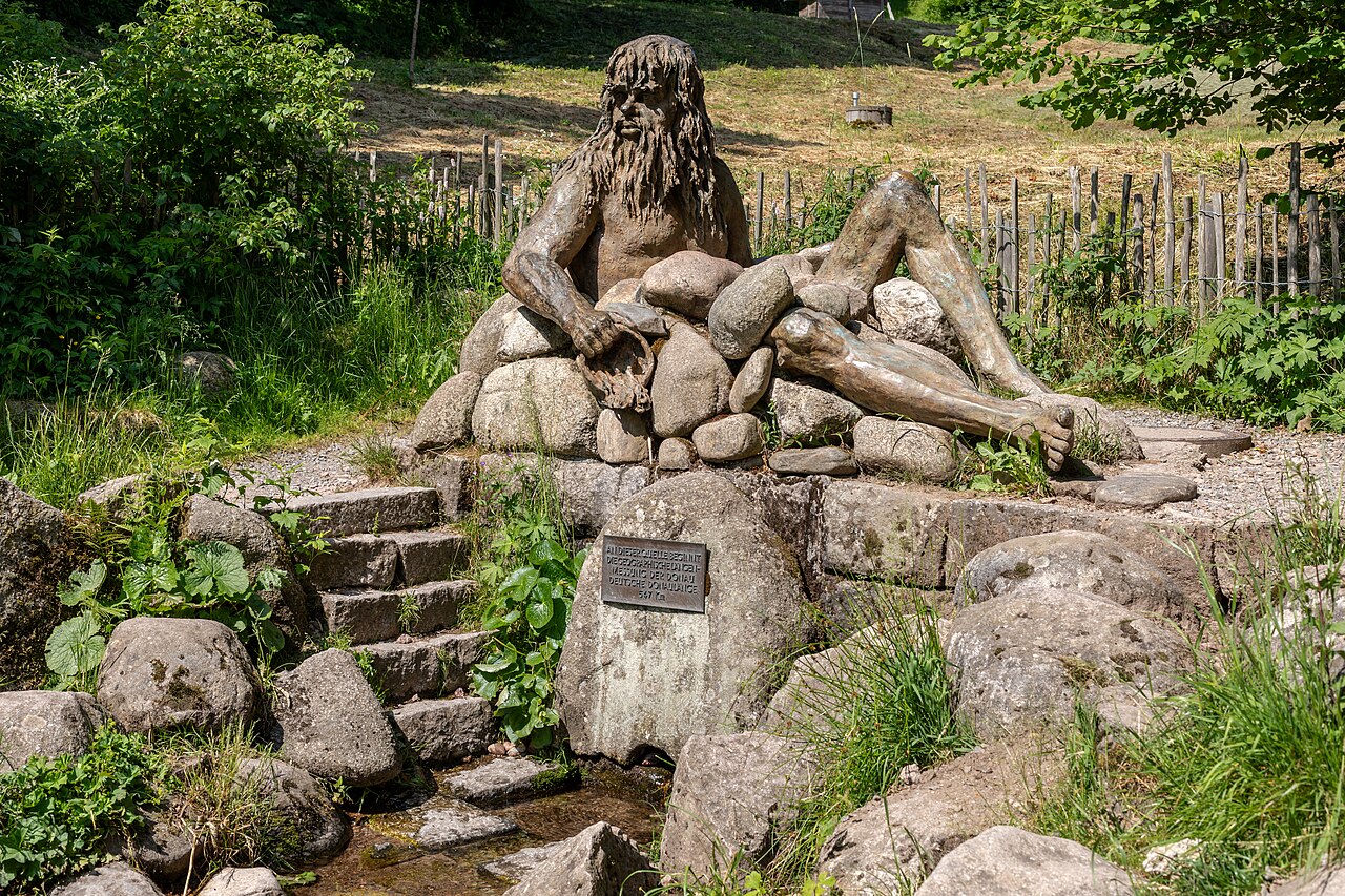 Sculpture “Danuvius” (Wolfgang Eckert, 2017) at the spring of the Danube (Bregquelle), Furtwangen im Schwarzwald, Baden-Württemberg, Germany