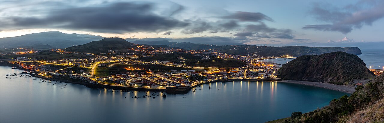 Overview of the city of Horta, one of the three capitals of the archipelago, during the blue hour from Monte da Guia, Faial Island, Azores, Portugal.
