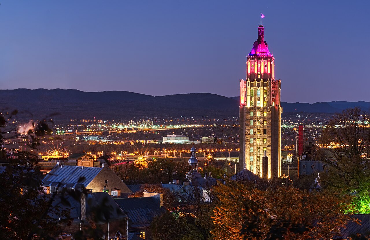 The Price Building illuminated at night in Quebec City.