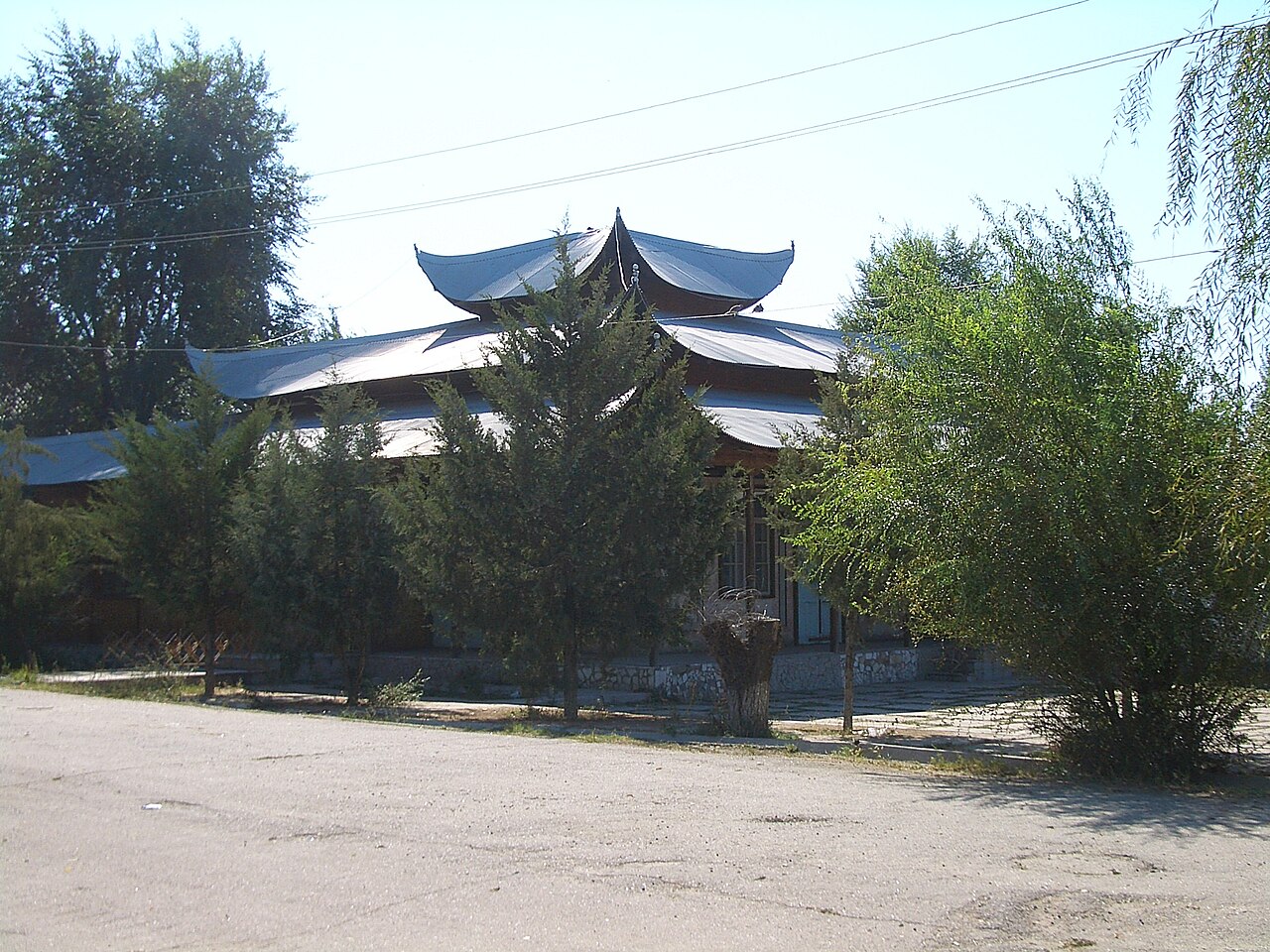 An apparently unused Chinese-style building in the center (Lenin St) of Milyanfan, a Dungan village in Chuy Province, Kyrgyzstan.