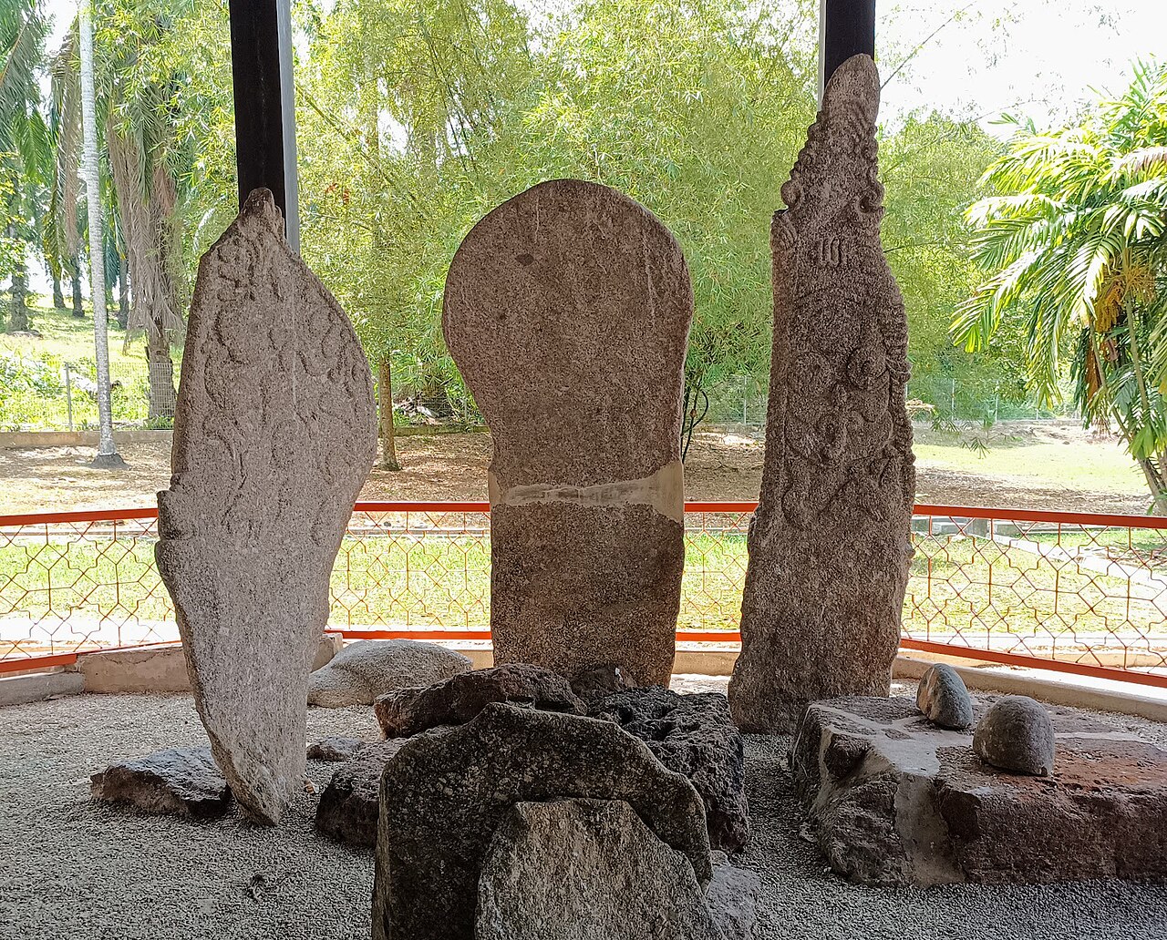 Three ancient standing stones in the Pengkalan Kempas historical centre, Negeri Sembilan, Malaysia
