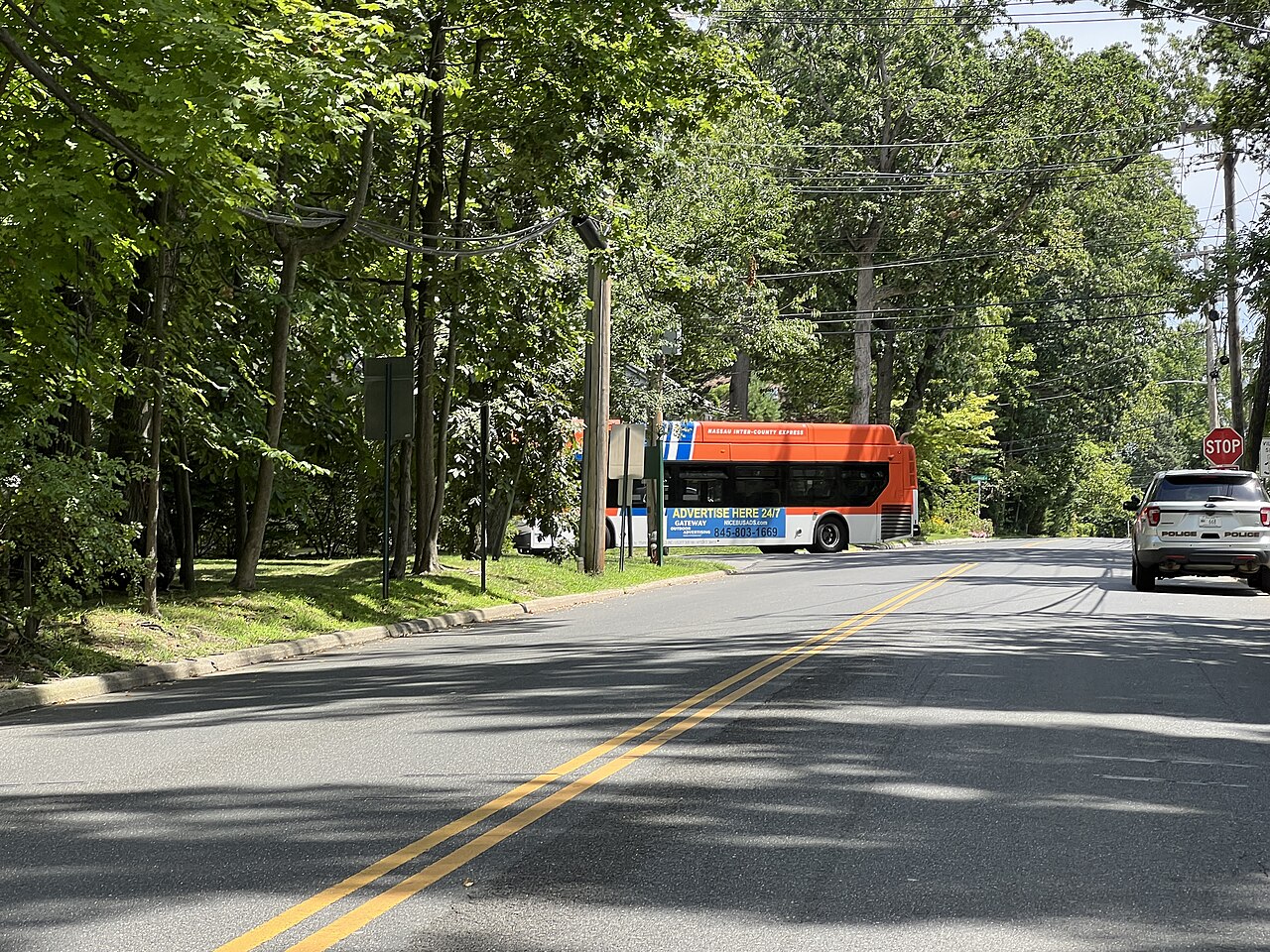 A Nassau Inter-County Express n58 bus turning onto Kings Point Road from Steamboat Road in the Inc. Village of Kings Point, NY on August 14, 2022.