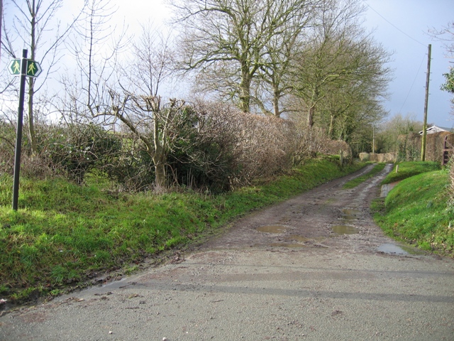 Lane and Footpath to Leeswood-Green Farm The photo is taken from the main road through Leeswood.  There is another footpath off to the left here as indicated by the signpost.