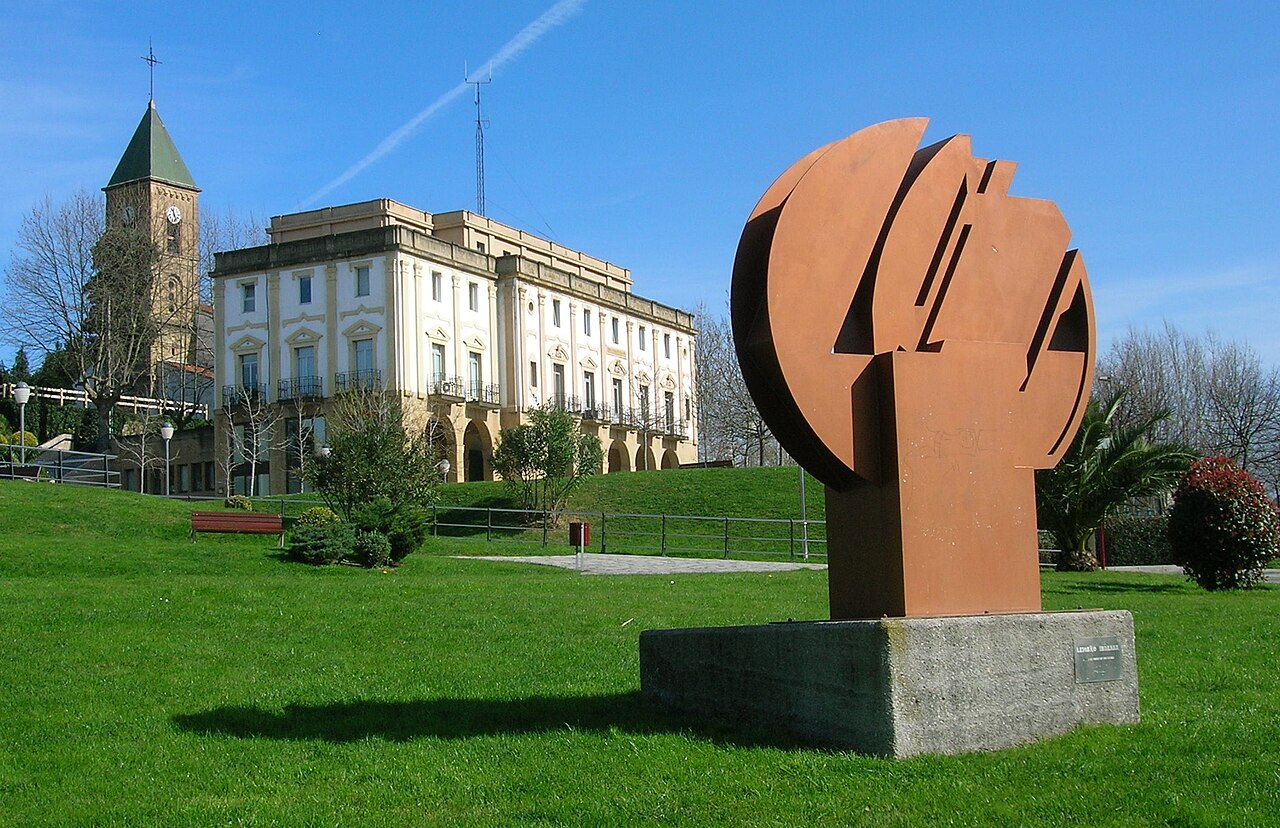 Saint John's church, XIX century town council and Leioako Indarra ("Strength of Leioa") sculpture by Nestor Basterretxea, Leioa.