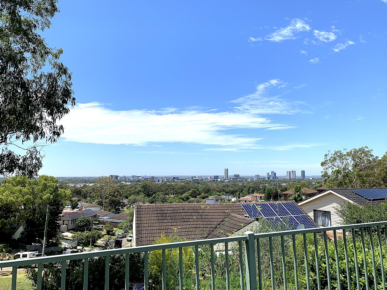 Skyline of Liverpool, NSW, Australia viewed from Oliphant Street, Mount Pritchard. A southeast panorama view of the southwestern suburbs of Sydney showing the immense urban tree canopy of the area. Suburbs in view include Cabramatta and Warwick Farm. Cabramatta Golf Course is in the centre of image.
