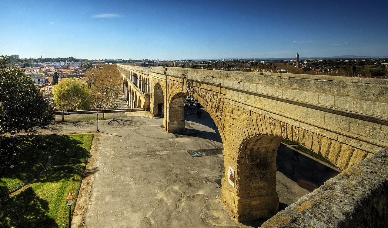 The ancient Romans constructed numerous aqueducts  to supply water to cities and industrial sites. These aqueducts were amongst the greatest engineering feats of the ancient world, and set a standard not equalled for over a thousand years after the fall of Rome. Many cities, such as Segovia, still maintain and use the ancient aqueducts for their water supply even today. 
The Romans typically built numerous aqueducts to serve any large city in their empire, as well as many small towns and industrial sites. The city of Rome itself, being the largest city, had the largest concentration of aqueducts, with water being supplied by eleven aqueducts constructed over a period of 500 years. They served potable water and supplied the numerous baths and fountains in the city, as well as finally being emptied into the sewers, where they performed their last function in removing waste matter. The methods of construction are well described by Vitruvius in his work De Architectura written in the first century BC. His book would have been of great assistance to Frontinus, a general who was appointed in the late first century AD to administer the many aqueducts of Rome. He discovered a discrepancy between the intake and supply of water caused by illegal pipes inserted into the channels to divert the water, and reported on his efforts to improve and regulate the system to the emperor Nerva at the end of the first century AD. The report of his investigation is known as De aquaeductu.
In addition to masonry aqueducts, the Romans built many more leats; channels excavated in the ground, usually with a clay lining. They could serve industrial sites such as gold mines, lead and tin mines, forges, water-mills and baths or thermae. Leats were very much cheaper than the masonry design, but all aqueducts required good surveying to ensure a regular and smooth flow of water.

From Wikipedia, the free encyclopedia