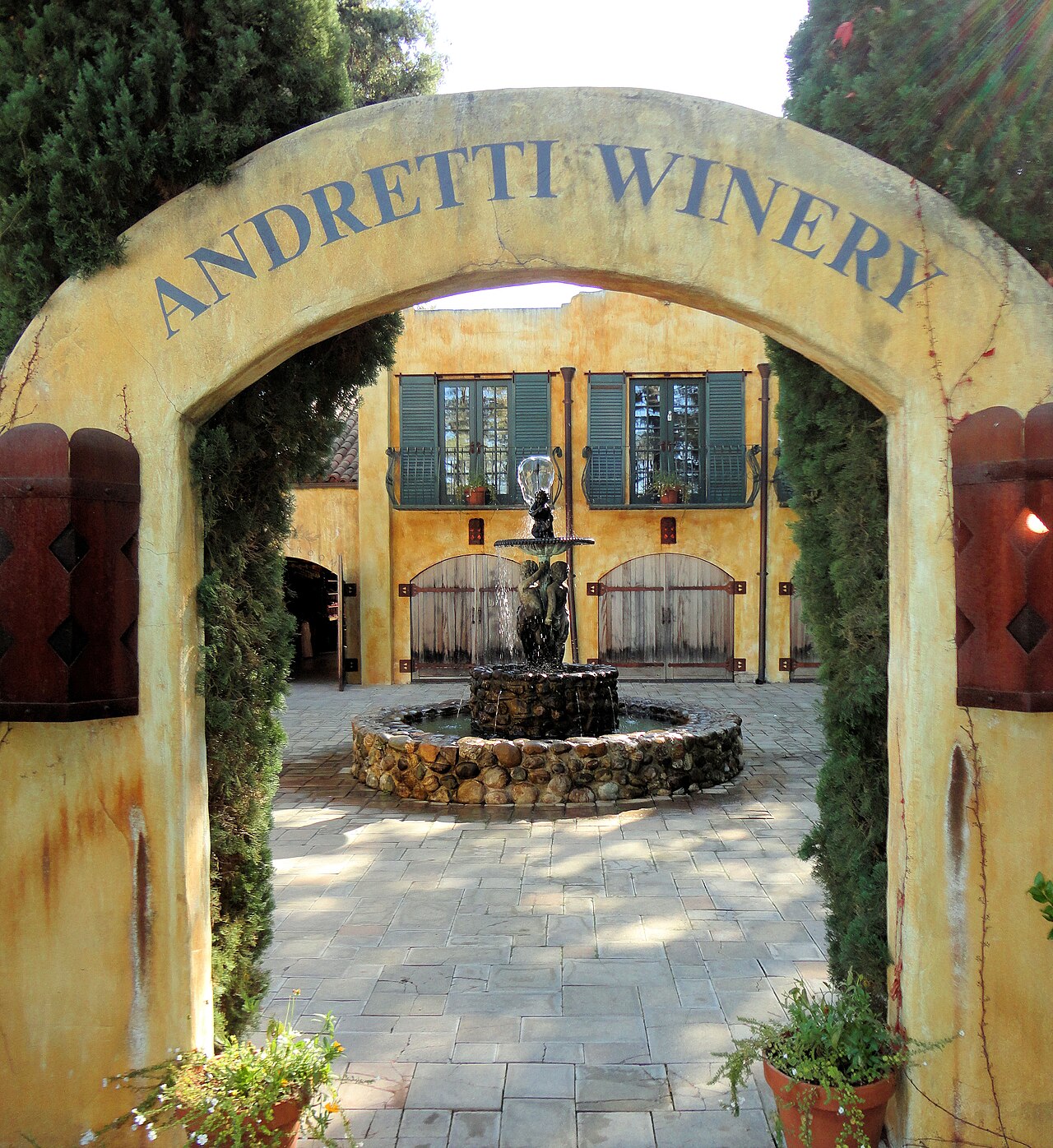 Andretti Winery, Napa Valley, California, USA
Winery Story:
The finest things in life are often hidden away and that’s the case with the award-winning Andretti Winery.  
Nestled alongside a quiet country lane in the heart of the legendary Napa Valley, Andretti Winery exudes Old World Charm as it whisks wine lovers back in time to a slower pace of life. Modeled after a rambling Italian village, the winery conjures up the boyhood home of its namesake, Mario Andretti, the finest race car driver of all time.  
Founded in 1996 by Mario Andretti and his longtime friend, Joe Antonini, former Chairman &amp; CEO of Kmart Corporation, Andretti Winery is dedicated to celebrating the Italian lifestyle, complete with the finest wines produced anywhere in the world. Blessed with premium grapes grown in the most acclaimed valley in California, Andretti Winery produces an array of wines that – like Mario Andretti himself – are second to none. 

We invite you to taste the good life, Andretti style.