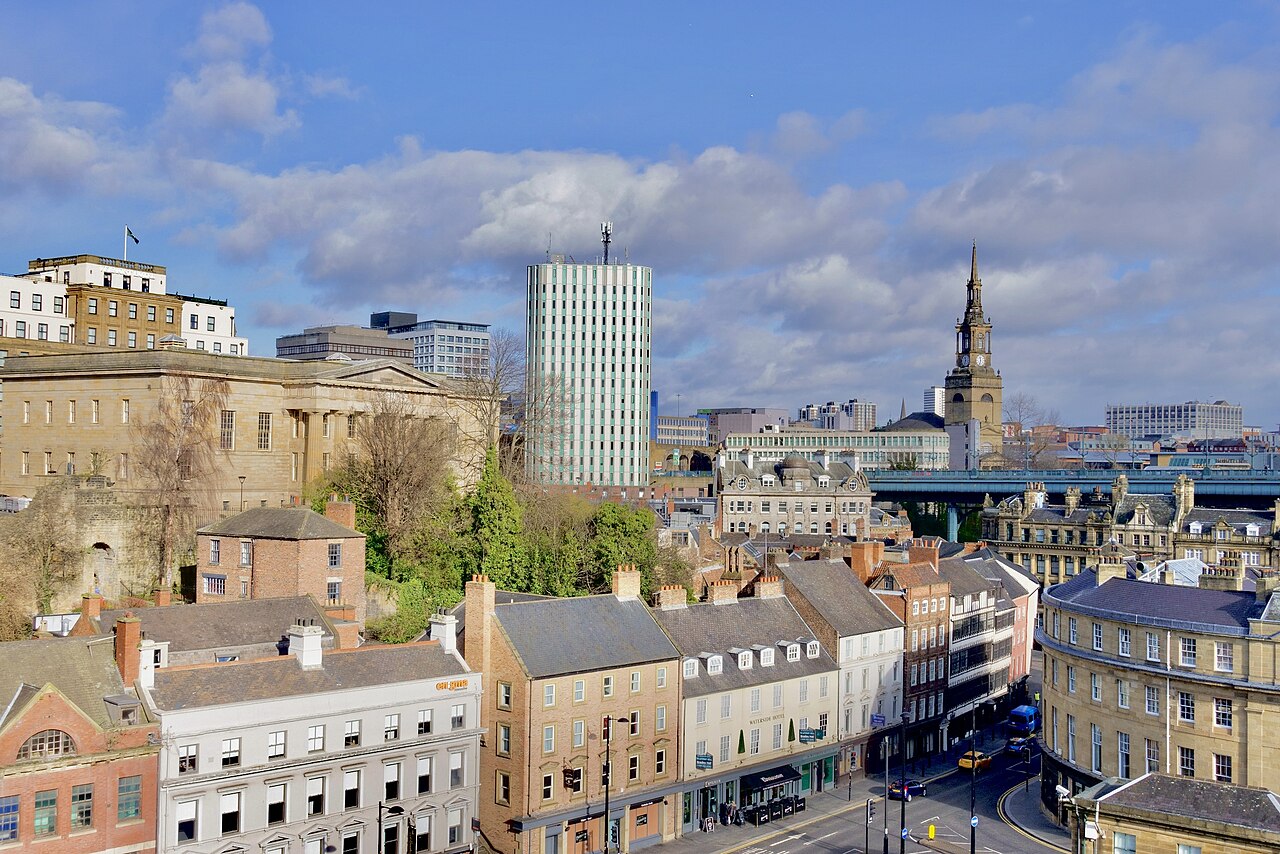 Sandhill is an old street of the Quayside area of Newcastle Upon Tyne with a number of historic buildings; it's seen here from the High Level Bridge. Other notable features of the view are the office block of Cale House at the centre of the image and The Moot Hall, the large stone building at the centre-left.
