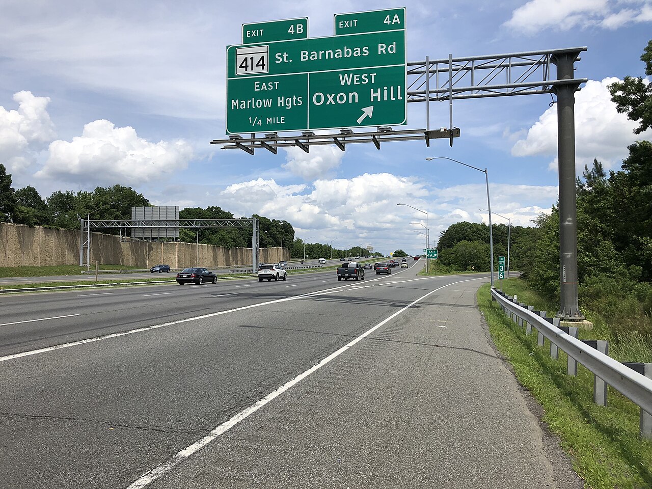 View north along the outer loop of the Capital Beltway (Interstate 95 and Interstate 495) at Exit 4A (Maryland State Route 414 West/St. Barnabas Road, Oxon Hill) along the edge of Glassmanor and Oxon Hill in Prince Georges County, Maryland