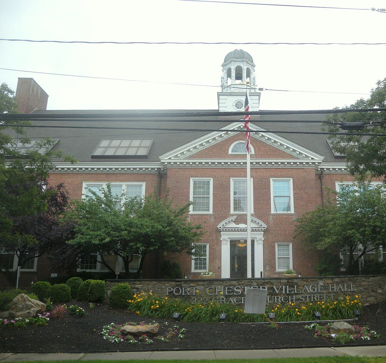 Looking west from Pearl Street at Port Chester Village Hall on a rainy day.