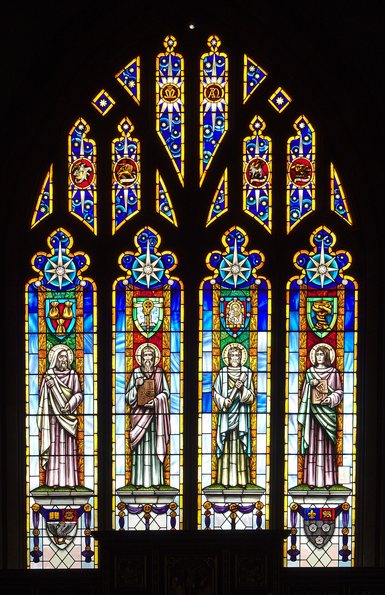 East window of Prescot Parish Church, depicting the Four Evangelists. In 1985 it replaced the 1840 original , which had become damaged.