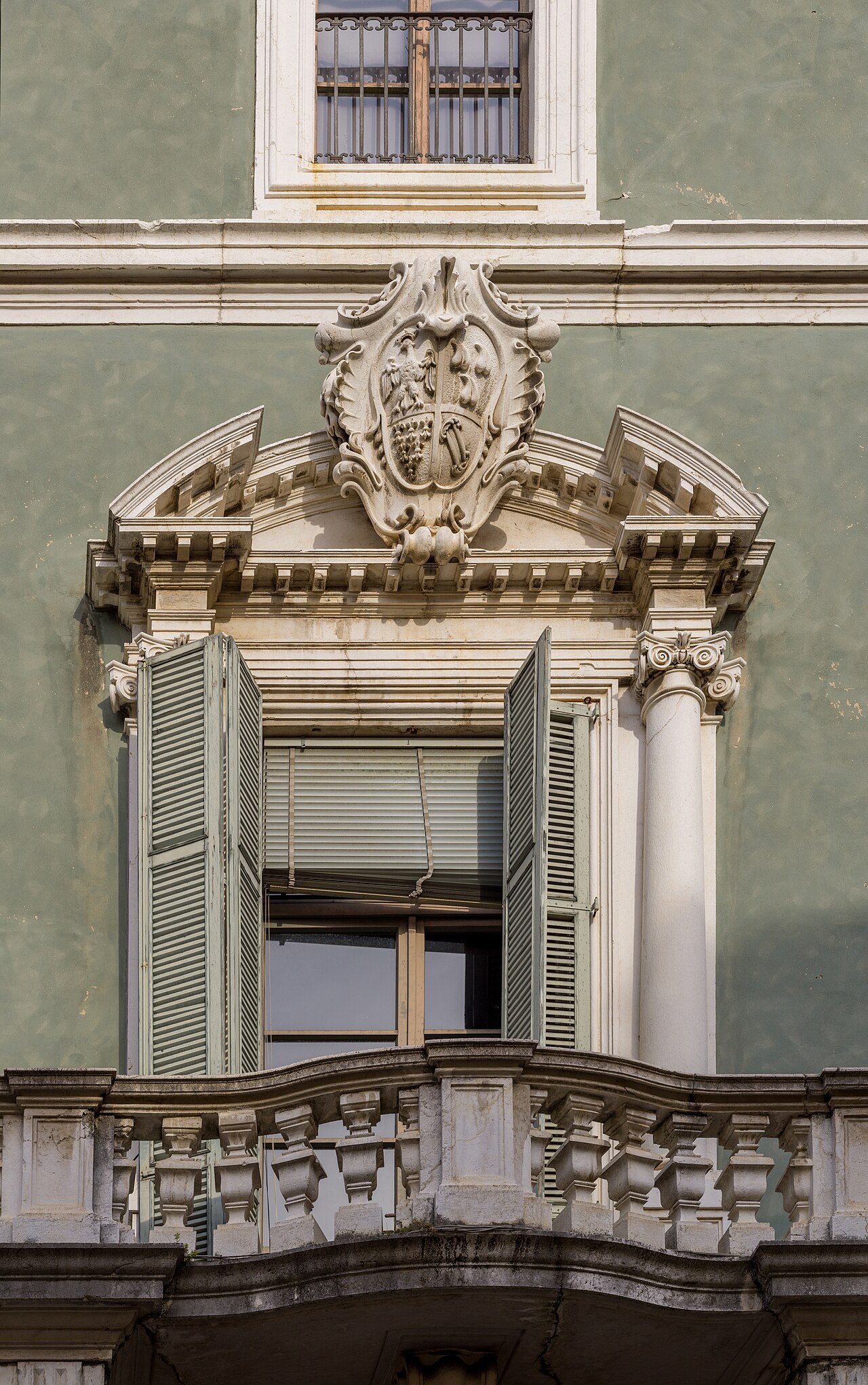 Detail with coat of arms of the facade of Palazzo Martinengo Colleoni di Malpaga on Corso Cavour street in Brescia.