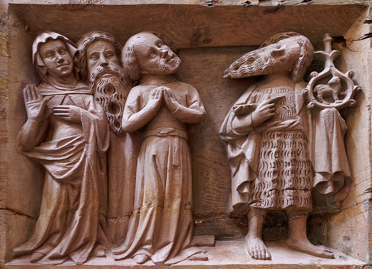 Wooden relief on a choir stall in Roskilde Cathedral, Denmark, depicting the preaching of St. John the Baptist