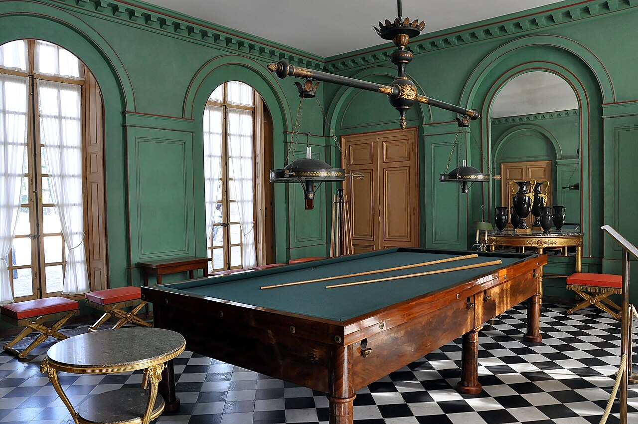 Billiard room in the Câteau de Malmaison in Rueil-Malmaison, France. Situated at the ground floor of the Château, this room was allocated to the billiard game since 1703. The current decoration is designed by Louis-Martin Berthault in 1812, with the sober furniture as at the time of Joséphine de Beauharnais.
