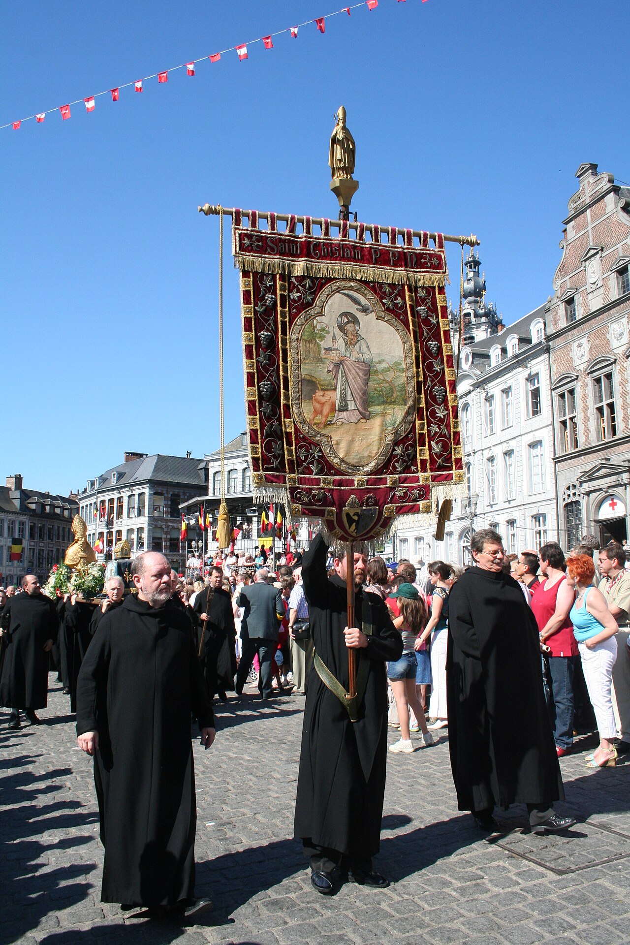Mons (Belgium), brotherhood of Saint Ghislain, escorting the reliquary shrine of the saint during the  procession of the "Car d'Or" (Golden Chariot) at  the Trinity Sunday.