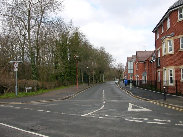 Rugby-Saint Peters Road On the right, the new housing development on the site of the Lodge Plug Factory. The left side of the road is the wooded cutting of the Great Central Line.