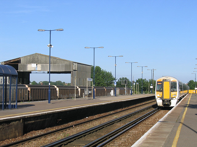 Sittingbourne station - east end The east end of the long (12-coach length) platforms at Sittingbourne.  375803 arrives with the 18.17 limited-stop service to London Victoria via Bromley.  At the left are some freight wagons in a siding.