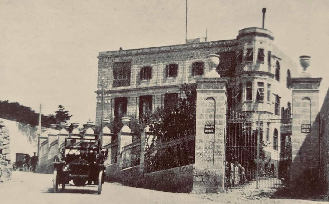 Hotel Savoy, Sliema circa 1915

"My family recently came into possession of this vintage photograph. The Savoy Hotel at the top of Rue d'Argens, photographed by Richard Ellis, British-Maltese photographer who was one of the pioneers of photography in Malta during the late 19th and early 20th centuries. 
The Studebaker-Garford 1904-11 model automobile in the frame has the Savoy Hotel chauffeur driving the hotel’s proprietor, Joseph Galea and his wife Annetta (my grand-parents). My grandfather, Joseph Galea (1874-1955), owned several of these vehicles. 
In its heyday, the Savoy was a prominent hotel, managed by my grandfather from 1904-48. It boasted magnificent views of the Sliema promenade. 
My father, Henry Galea LRSM (London), who was born and raised at the Savoy said that on a clear day you could see the outline of Sicily, some 60 miles north of Malta.
Photo courtesy of Michael Sammut, and my brother Edwin Galea. 

It’s highly likely that this photo was taken during World War I." - Ray Galéa [1]