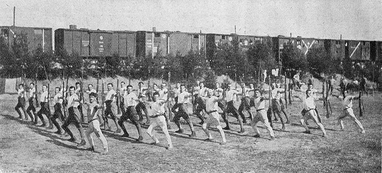 Original caption: Czechoslovak Legionaries in on the Trans-Siberian Railway, performing Sokol exercises under cover of their "těplušky" (railway trucks)