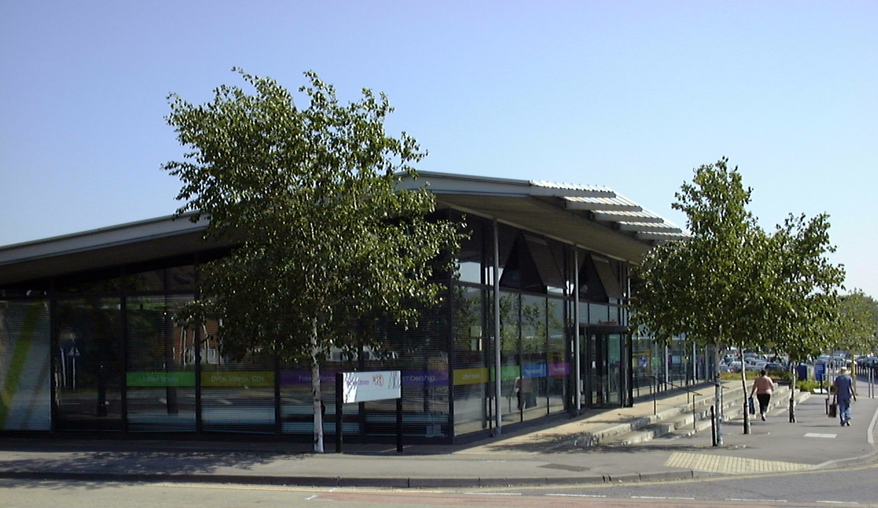 The public library in Tadley, Hampshire, England. The picture was taken under conditions of sun and clear sky at approximately 09:30 UTC. The equipment used was a Toshiba PDR-M1 in Auto mode. The original picture was cropped from the bottom to remove excess foreground.