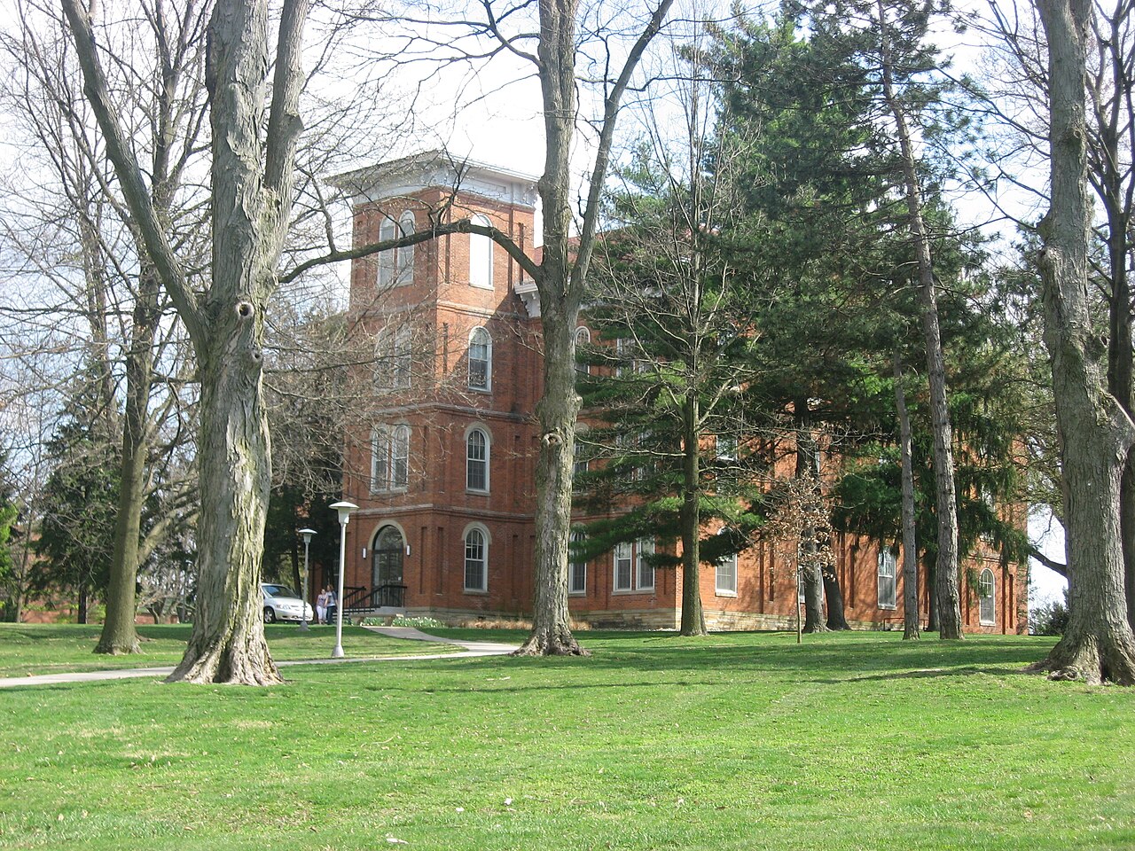 Grounds of Wilmington College, including College Hall.  Photo is taken just southeast of the intersection of College Street with Fife and Rombach Avenues (U.S. Route 22/State Route 3) in Wilmington, Ohio, United States.  Built in 1866 and the oldest building on the campus, College Hall is listed on the National Register of Historic Places.