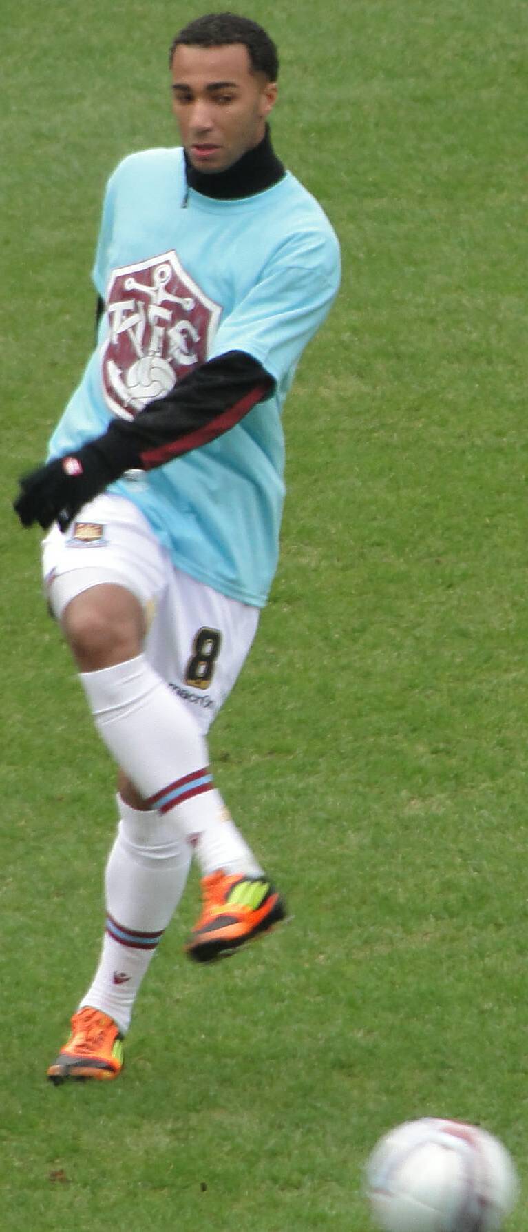 West Ham United footballer, Nicky Maynard, warming up before West Ham's game and win against Millwall.