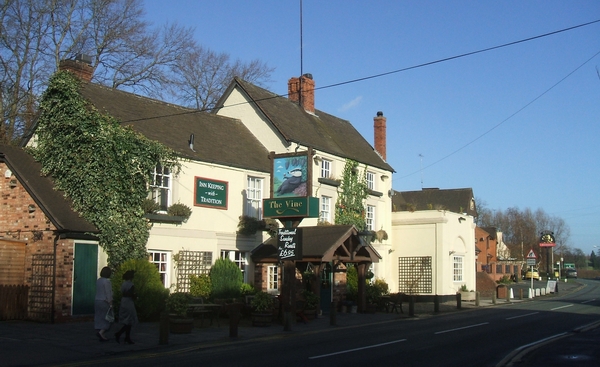 The Vine public house in Wombourne, Staffordshire, Great Britain - a traditional hostelry on the edge of Wombourne village opposite the Police Station. It is a contrast to the more recent pub next door.