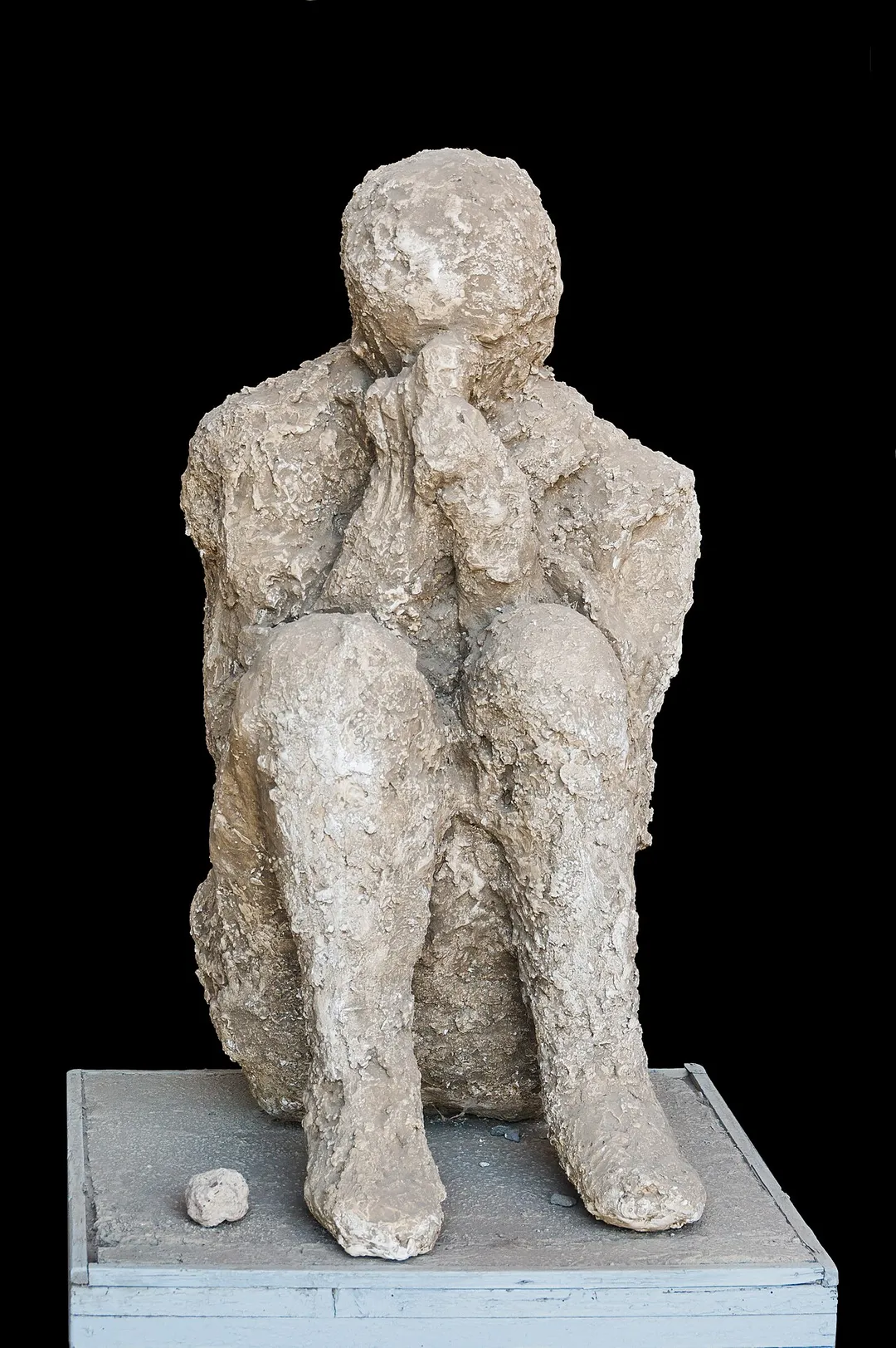 Cast of a sitting victim of the eruption of Mount Vesuvius, 79 CE, Pompeii, Italy.