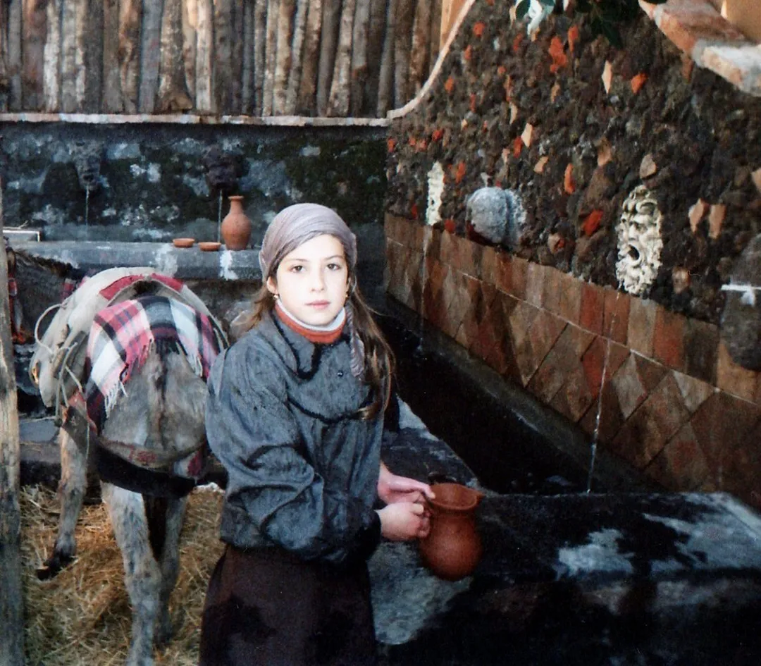 A young Sicilian artisan preparing the set for a living Nativity scene in Santa Maria La Stella, Sicily