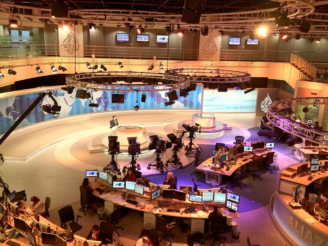 Photo from balcony overlooking main television studio towards presenter's desk in the Doha headquarters.